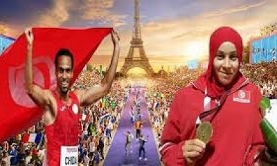 محمد فرحات شيدة  و مروى البرهومي  يحملان  الراية الوطنية في افتتاح الألعاب البارالمبية