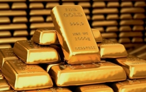 الذهب ينخفض اليوم  إلى 1933 دولاراً للأوقية